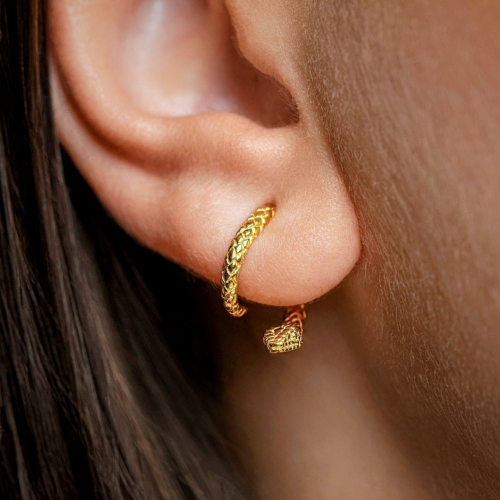 Refined twisted snake earrings. Can be positioned facing a variety of ways; NWOT